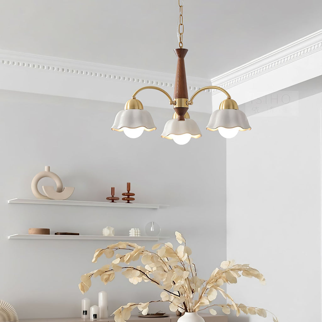 Brass arms and walnut centre of the chandelier seen up close