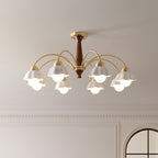 Brass chandelier with opaline ceramic shades in a styled interior