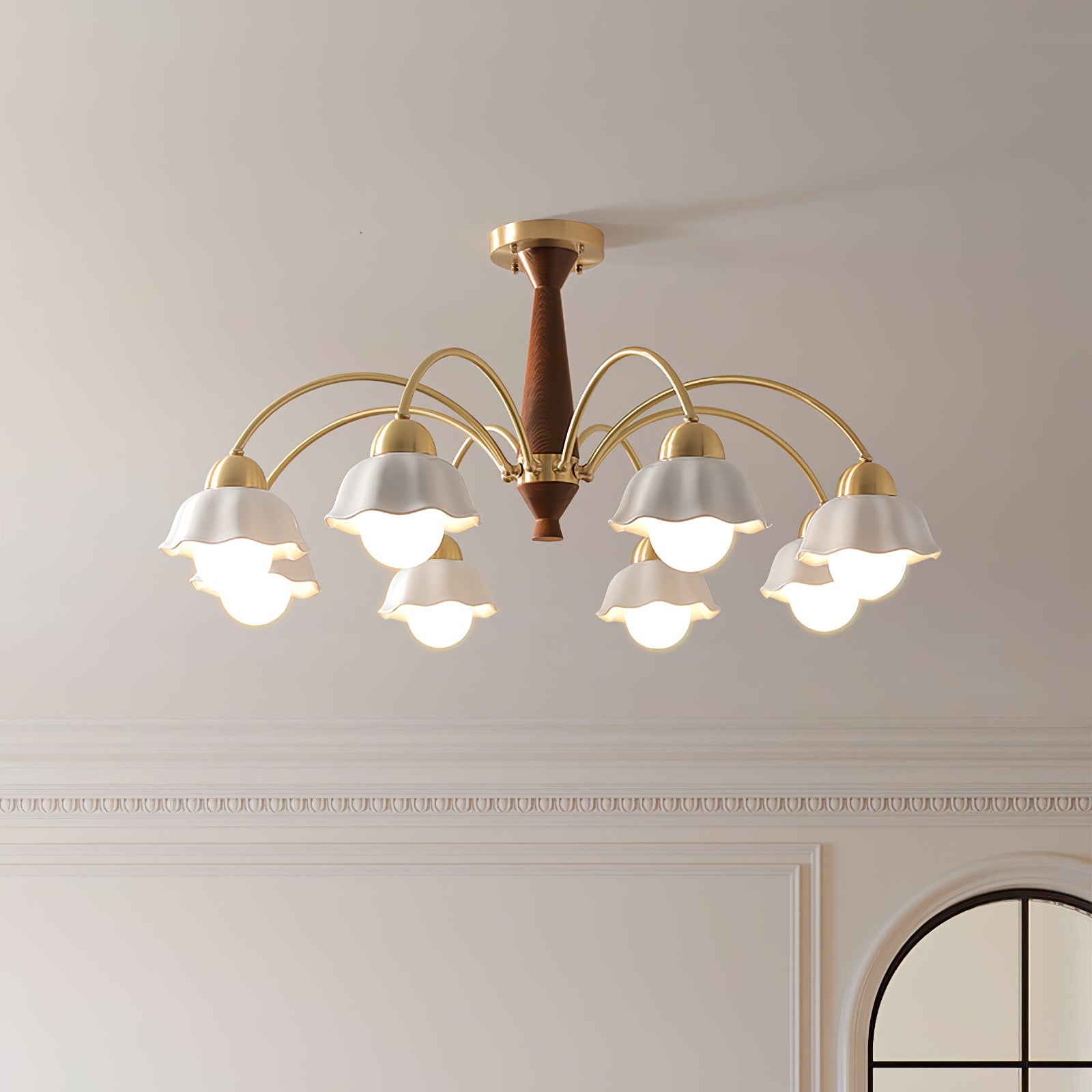 Brass chandelier with opaline ceramic shades in a styled interior