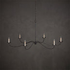 Against a dark backdrop, this Clérachic chandelier in black finish is shown without lampshades, bulbs bare.