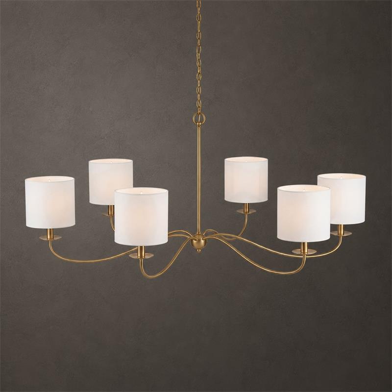 Against a dark backdrop, this Clérachic chandelier in gold finish shows its six white drum lampshades.