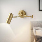 Swing arm wall sconce glowing warm white beside a chair