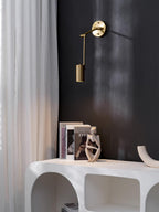 Swing arm wall sconce shown with the shade angled down
