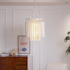 Wood rod chandelier suspended high in an open living area
