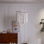 Swinton chandelier with white frame glowing in a warm interior