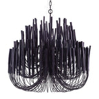 Wooden rod chandelier with white frame over a dining setting