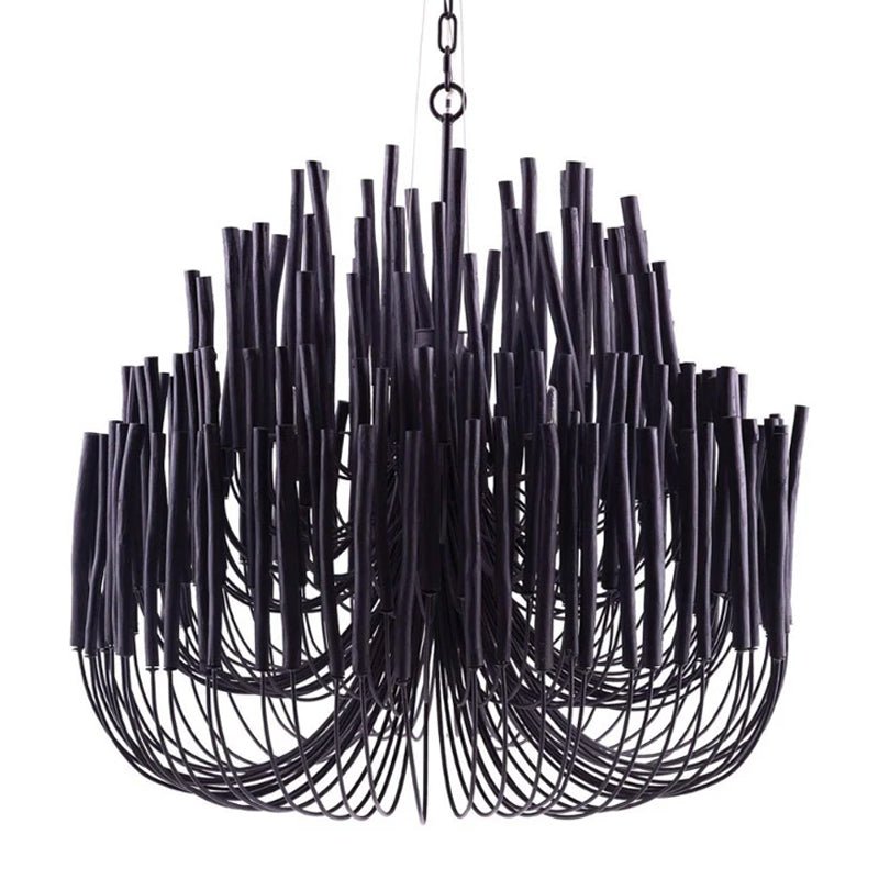 Wooden rod chandelier with white frame over a dining setting