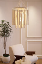 Natural wood chandelier casting soft light in a living room