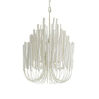 Natural wood chandelier glowing warmly above a seating area