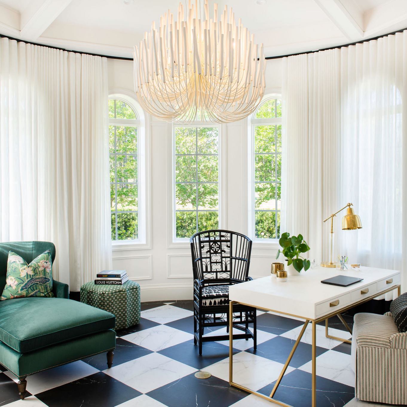 Swinton chandelier with layered natural wood rods on a white iron frame