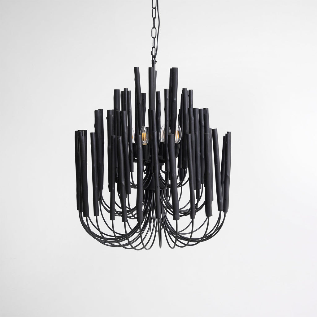 Swinton chandelier in black iron finish over a wooden dining table