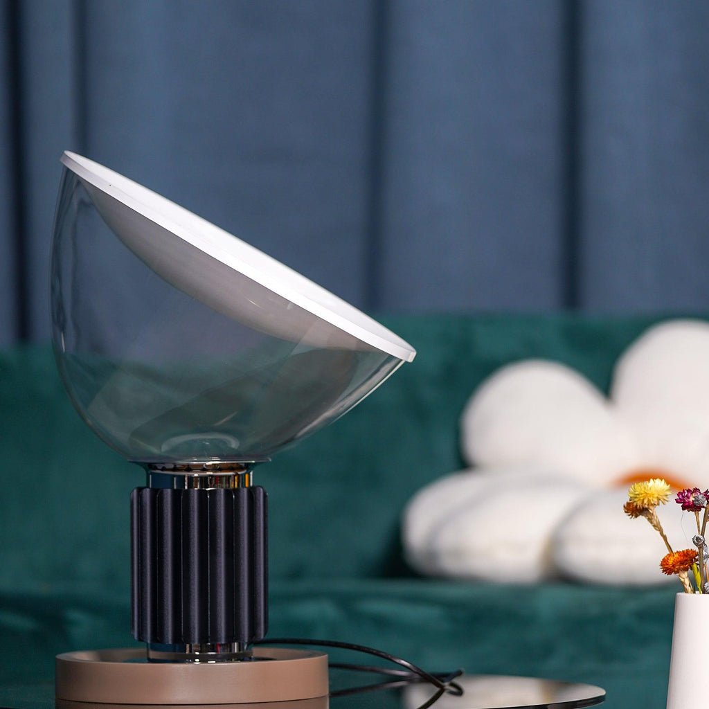 Table lamp side view showing aluminum reflector and clear glass