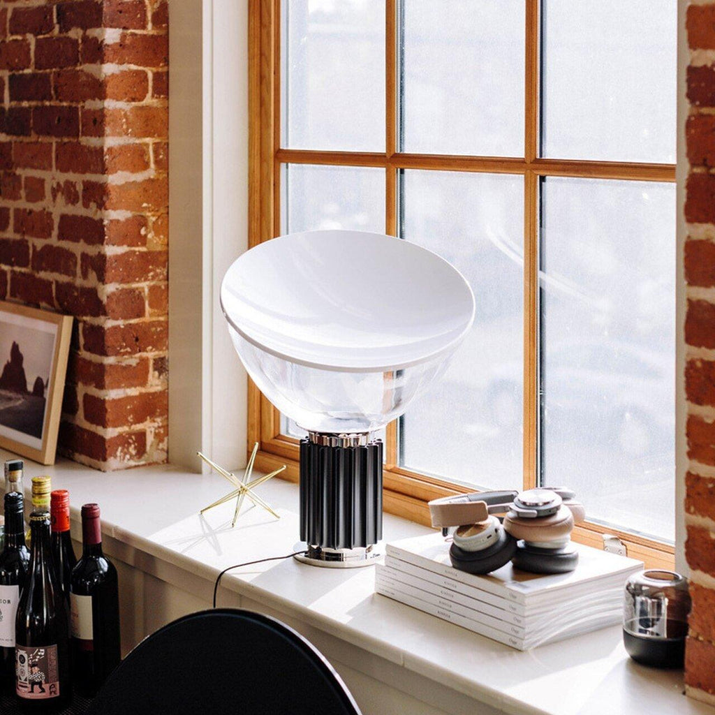 Aluminum reflector table lamp in a styled living room