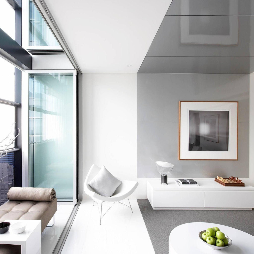 Modern white table lamp with blown glass diffuser detail