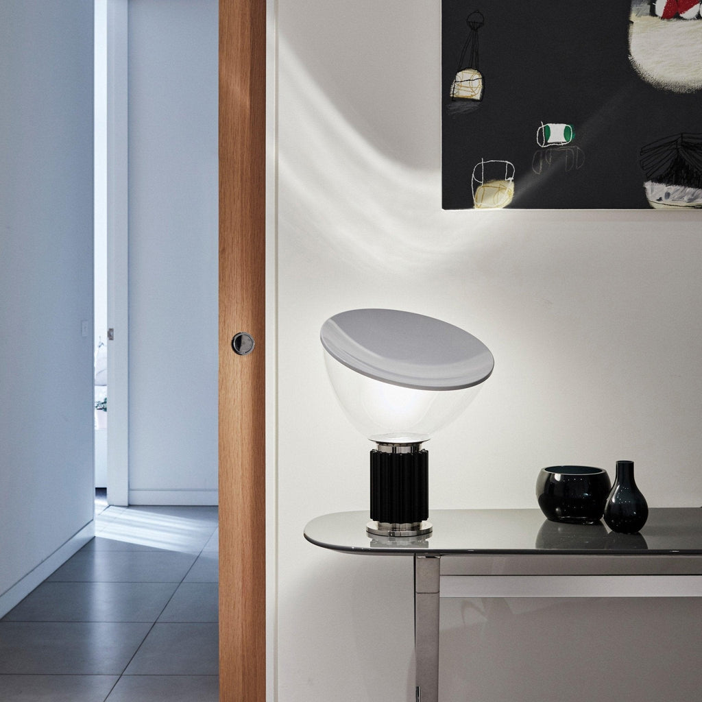 Aluminum reflector table lamp in warm-lit interior scene