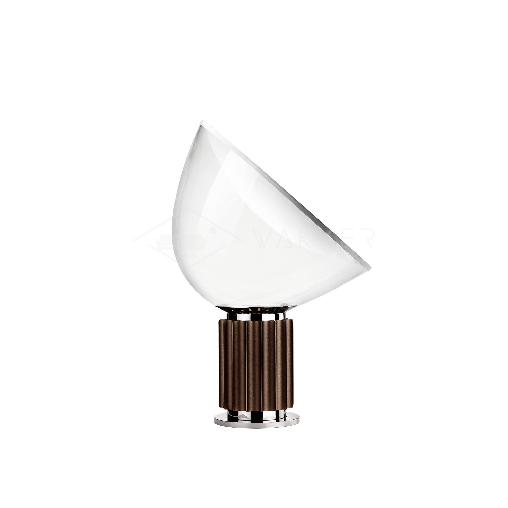 Table lamp glowing with warm light through clear glass diffuser