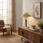 Tan fabric shade lamp with walnut base on a styled desk