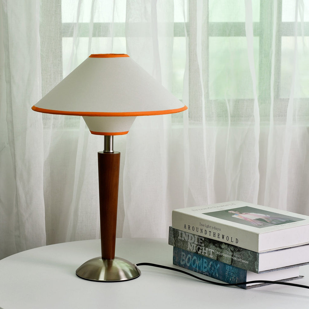 Walnut base table lamp with fabric shade shown from the side