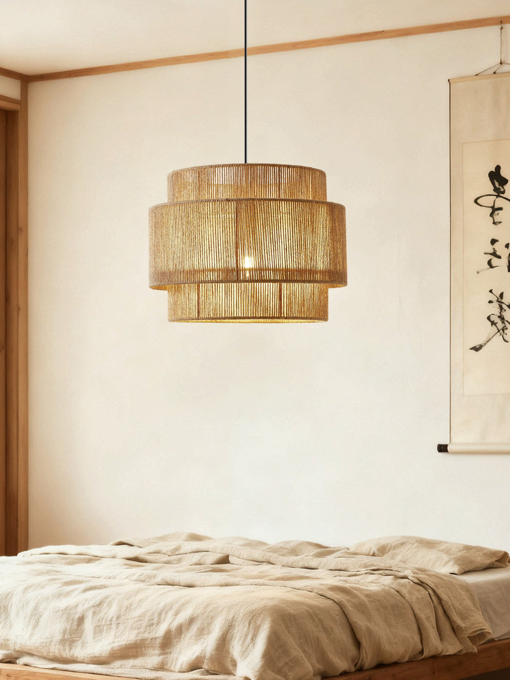 Above a linen-covered bed, this Clérachic pendant hangs beneath a wood-beamed ceiling and a hanging scroll painting.