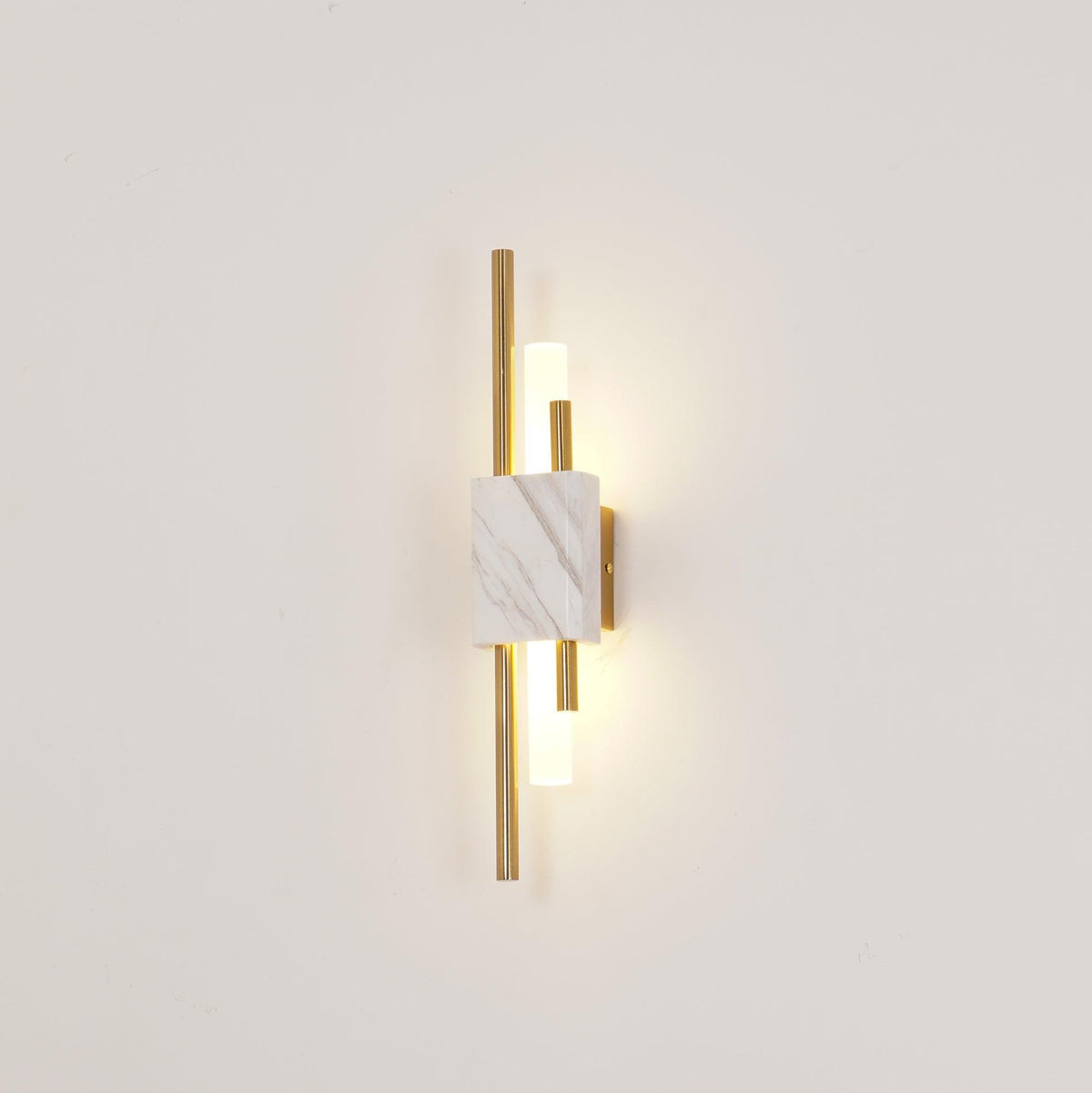 A different crop of the same Clérachic wall light, white marble front lit against a cream wall.