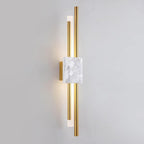 Marble and gold wall lamp shown against a neutral wall