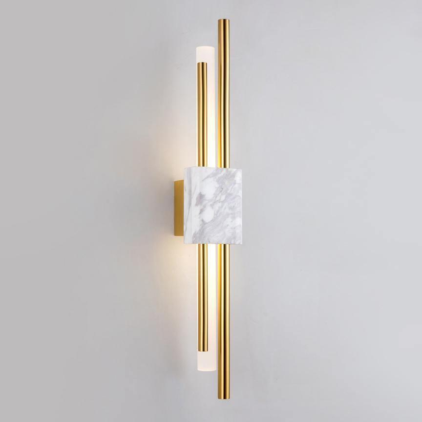 Marble and gold wall lamp shown against a neutral wall