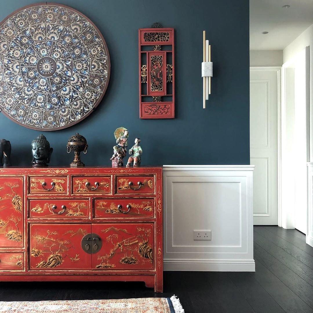 Marble cylinder sconce glowing in a softly lit living space