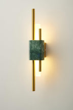 White marble and gold sconce lighting a minimal interior