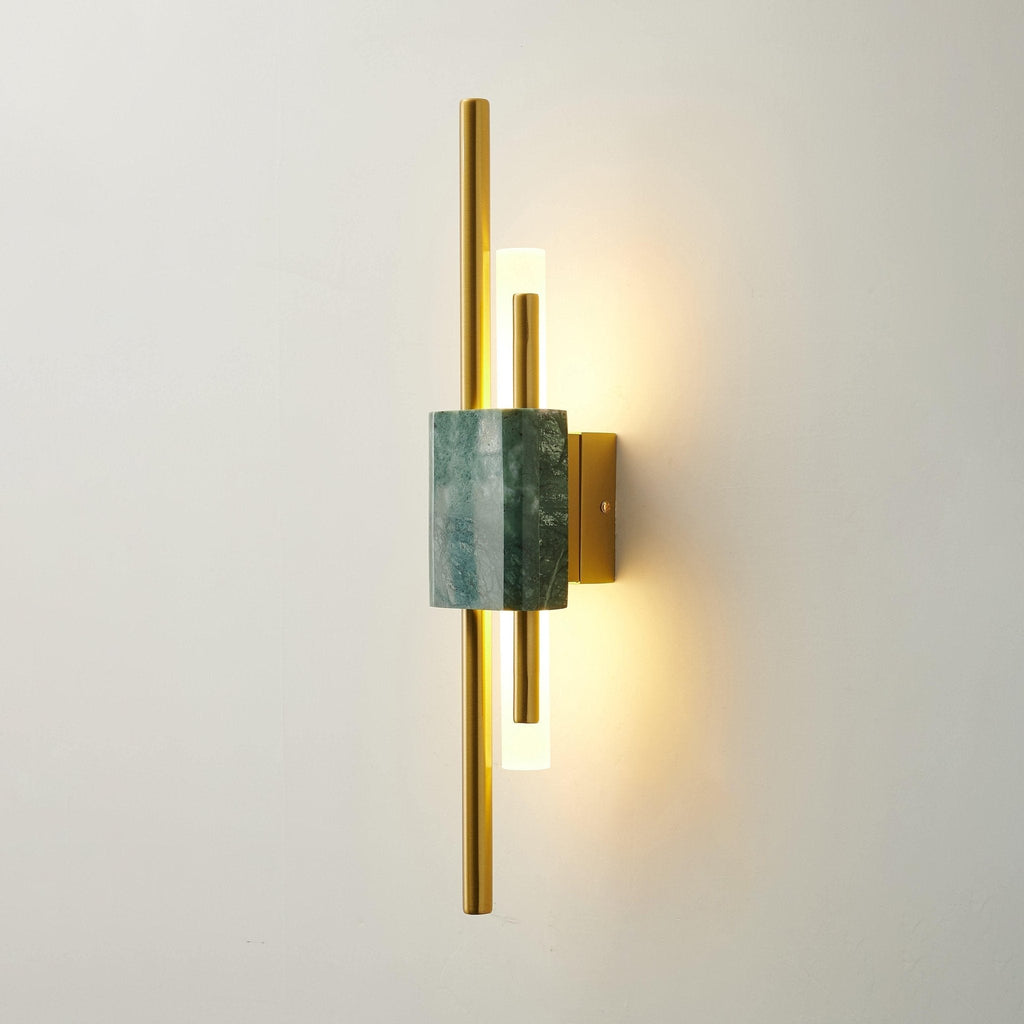Green marble wall lamp glowing softly in a styled interior