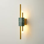 Green marble wall lamp glowing softly in a styled interior