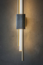 White marble wall lamp detail showing polished stone surface