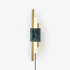 Clérachic brass-rod wall light with a square green marble front, shown alone against a plain white studio backdrop.