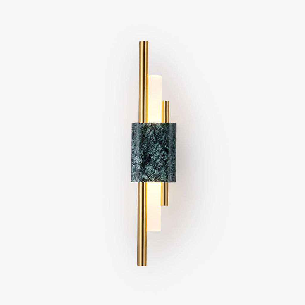 Green marble cylinder sconce illuminating a bedroom corner