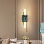 White marble wall lamp with gold detail and warm light output