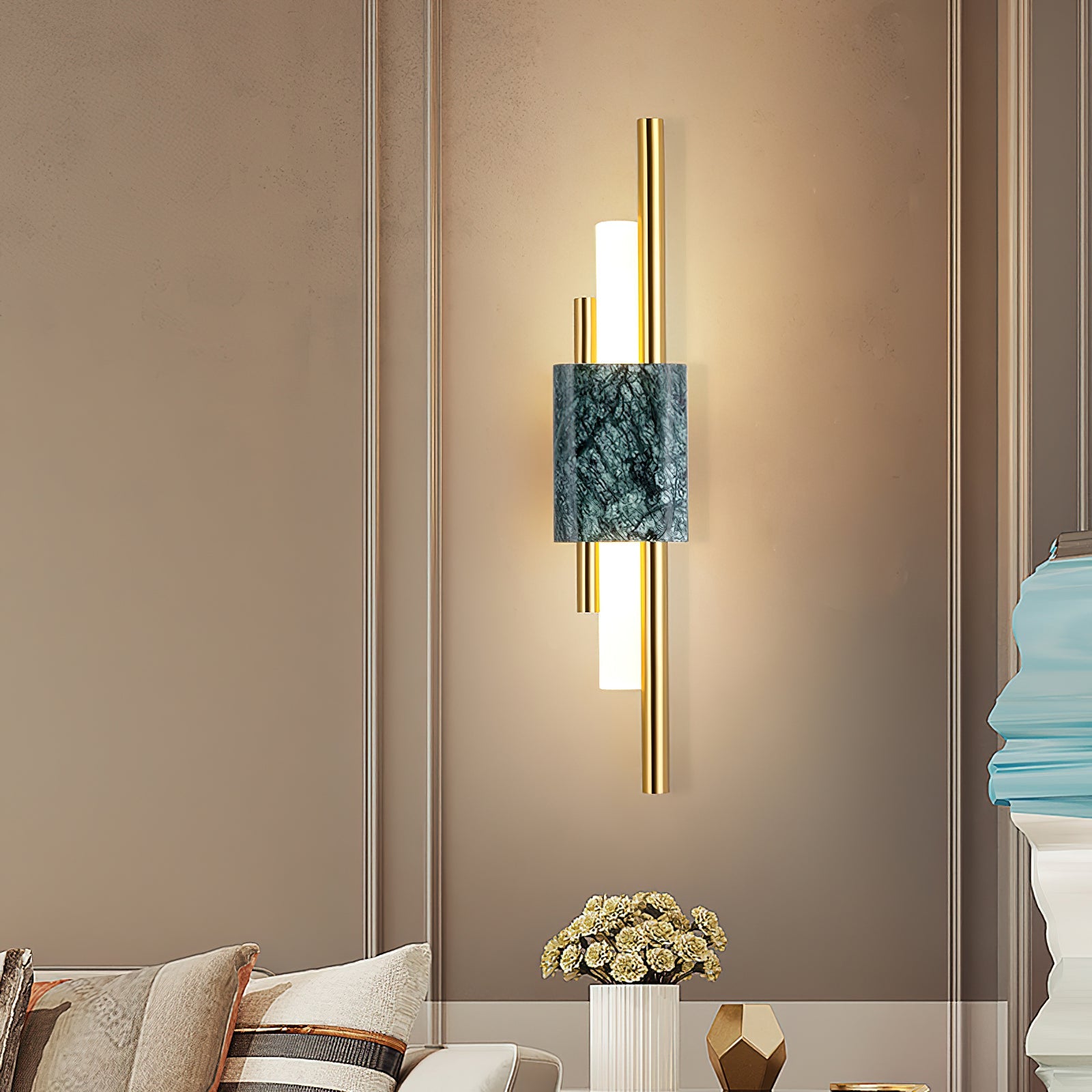 White marble wall lamp with gold detail and warm light output