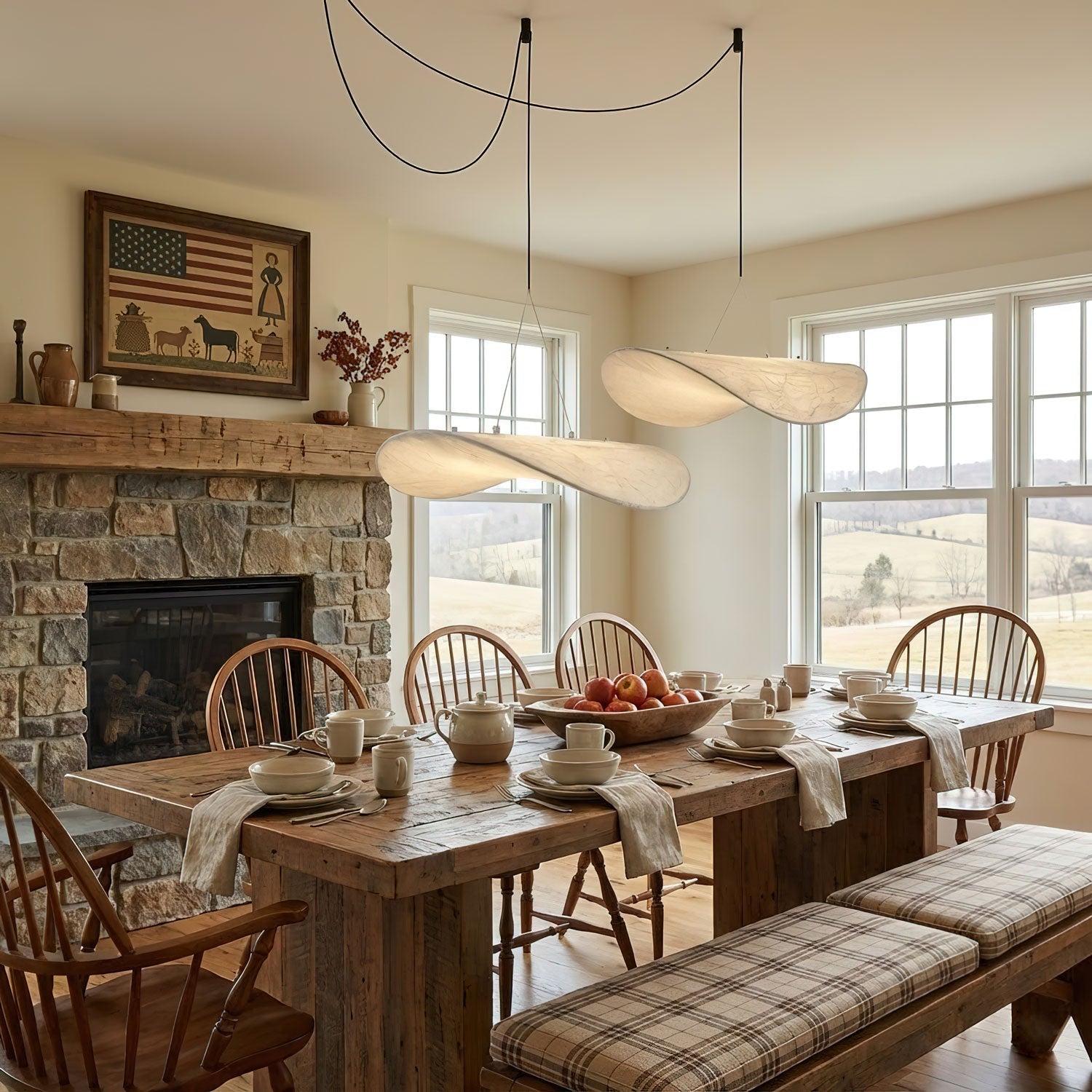 Mulberry silk pendant light glowing above a styled space