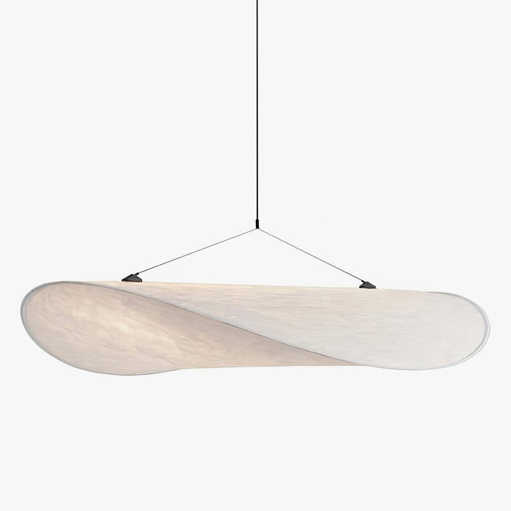 Paper pendant lamp with folded shade lighting a dining room