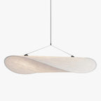 Tyvek pendant light with black accent over a wooden table