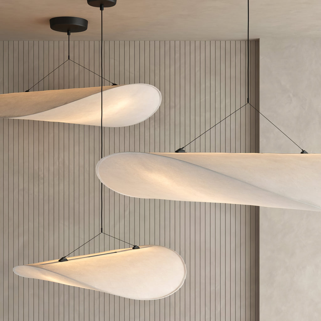 Sculptural Tyvek pendant light with warm light from below