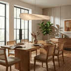 Round silk pendant light casting a soft floating glow