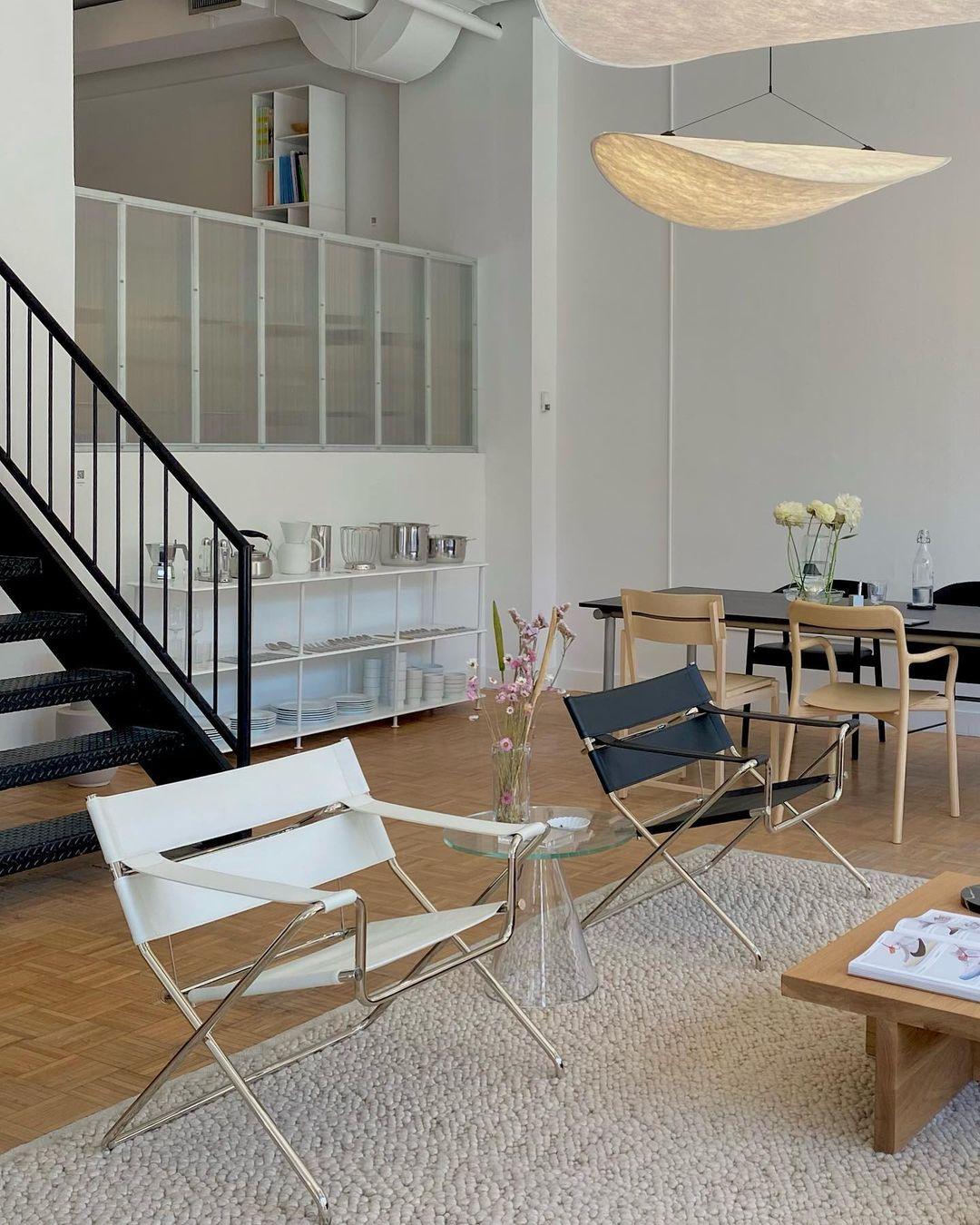 Oversized Tyvek pendant lamp suspended over a dining table