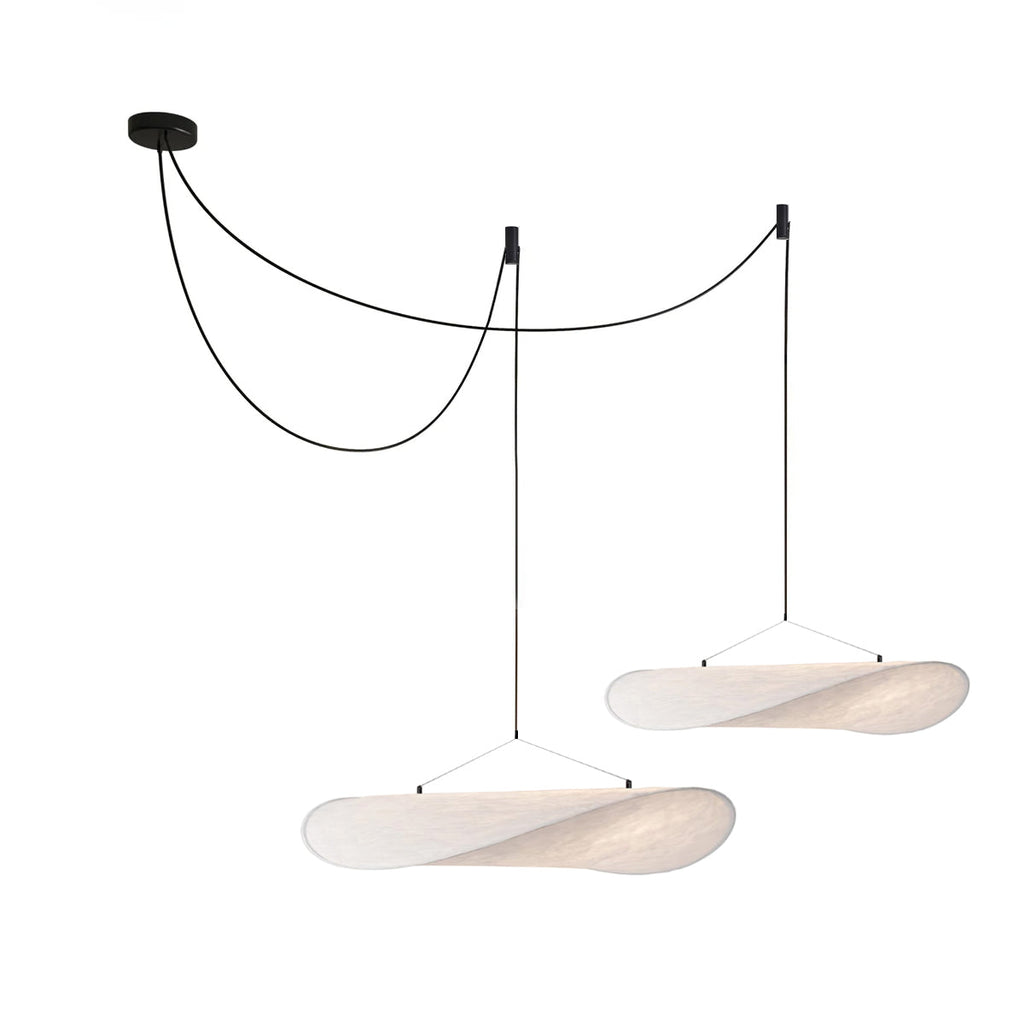 Silk pendant light shown from below with warm glow
