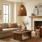 A leather armchair and linen sofa sit near a wood coffee table beneath this rattan Clérachic pendant.
