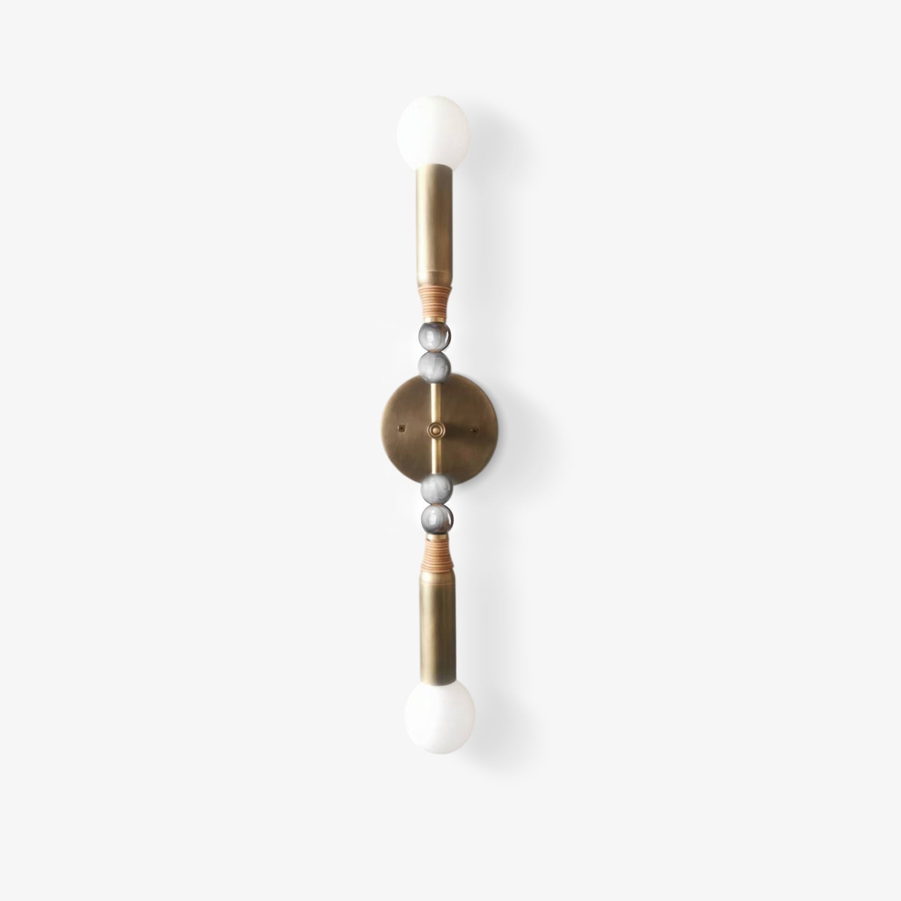 Antique brass and marble wall lamp throwing soft warm light