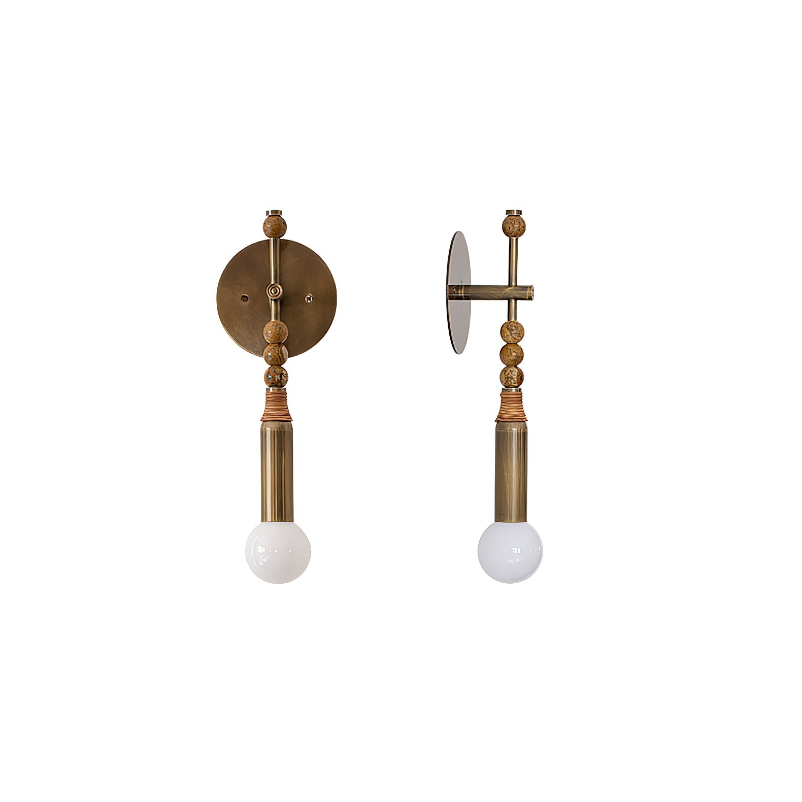 Antique brass wall sconce with stone detail in a refined hall