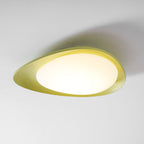 Angled low against a plain backdrop, this Clérachic ceiling light's green shell curves around a bright white diffuser.