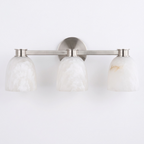 Studio shot of this Clérachic bar sconce in satin nickel finish, three dome alabaster shades set along its bar.