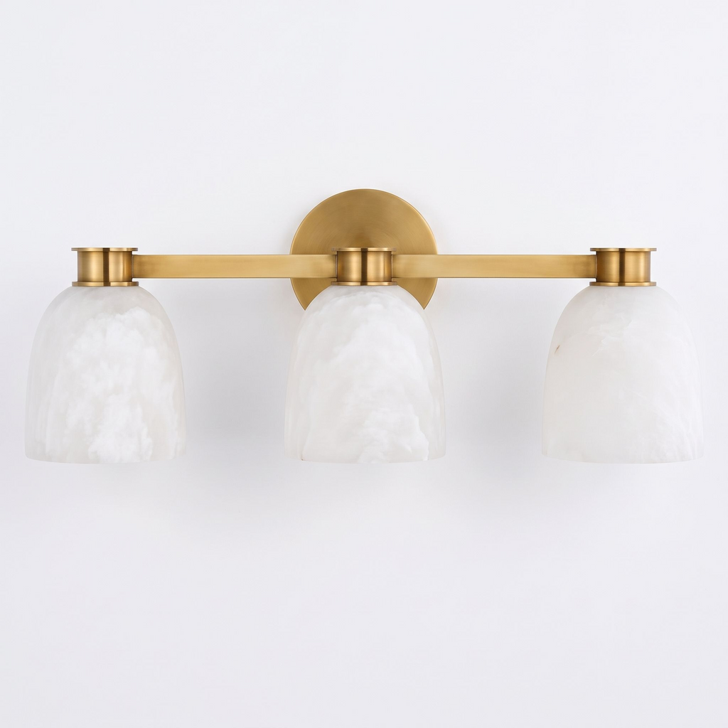 A front view of this Clérachic bar sconce in brass finish, showing the bar that spans its three dome shades.