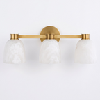 A front view of this Clérachic bar sconce in brass finish, showing the bar that spans its three dome shades.