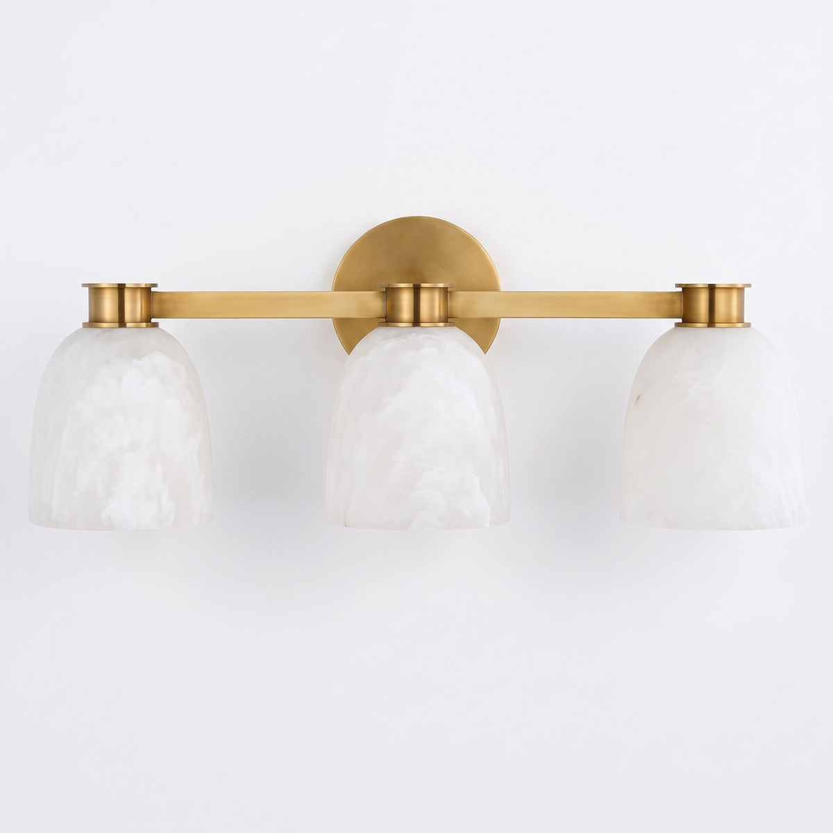 A front view of this Clérachic bar sconce in brass finish, showing the bar that spans its three dome shades.